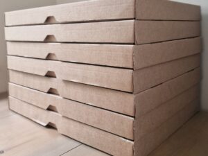 Stack of cardboard boxes with wooden grooves